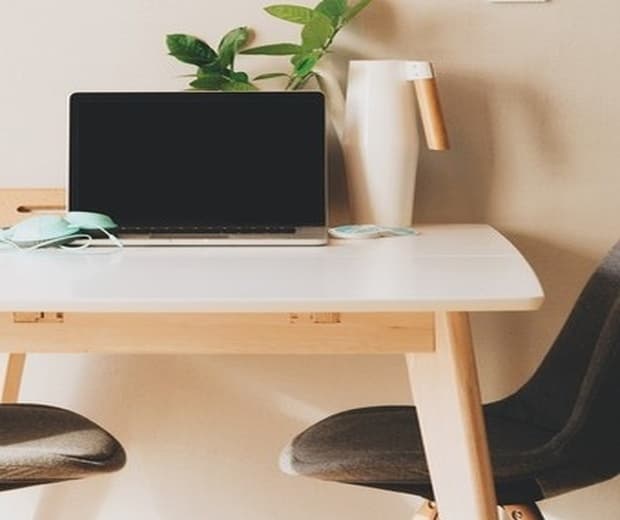 Freelancer reviewing pricing options and financial growth on InvoiceFlow dashboard